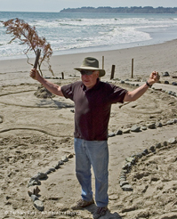Picture of man reciting a poem with a branch in hand